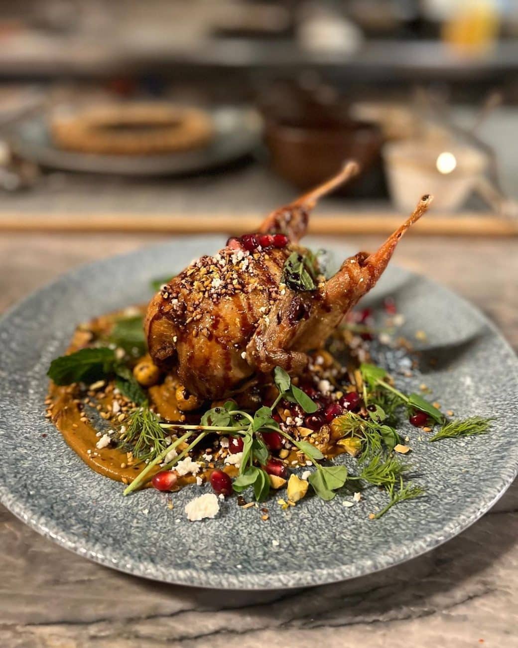 roasted quail with feta, pomegranate, and pistachio muhammara @statebirdprovisions