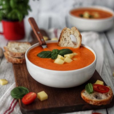 Creamy tomato soup with mozzarella and basil