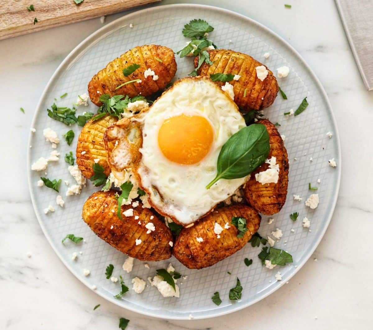 Hasselback potatoes with cheese and egg