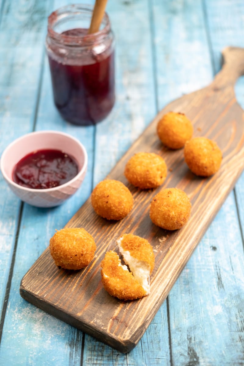 Fried cheese balls with parmesan and jam.